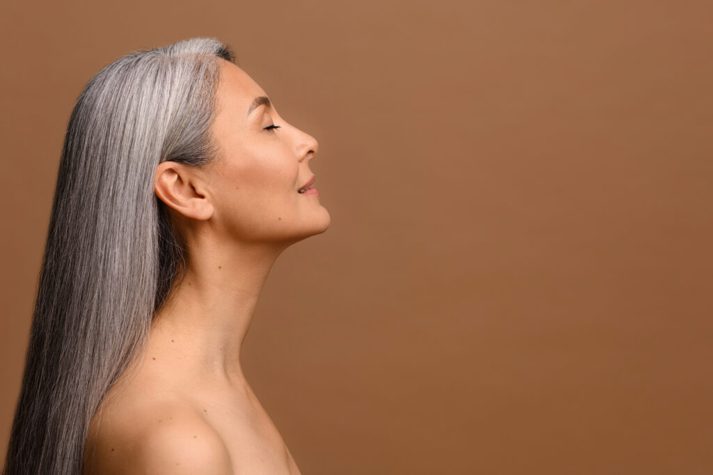 Mature Woman with Long Gray hair representing healthy aging and natural beauty