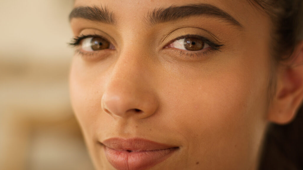 An Indian woman with glowing skin post after Kybella treatment