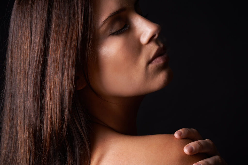 Woman with glowing skin after professional facial rejuvenation treatment
